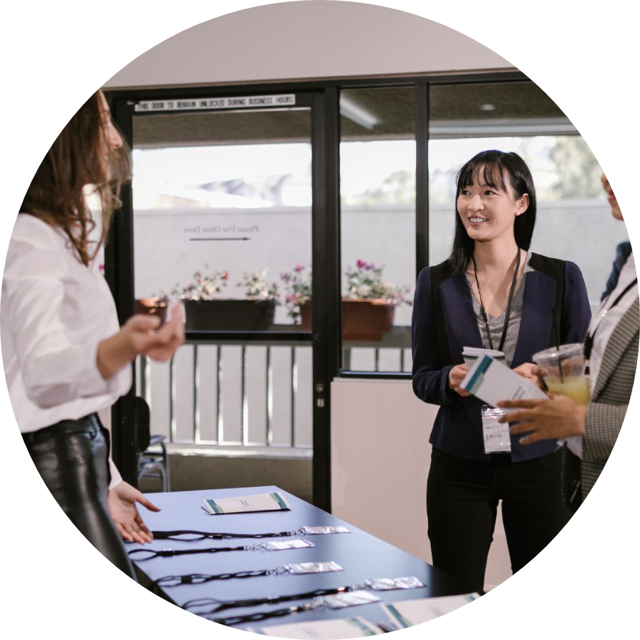 Two professionals talking at a business event
