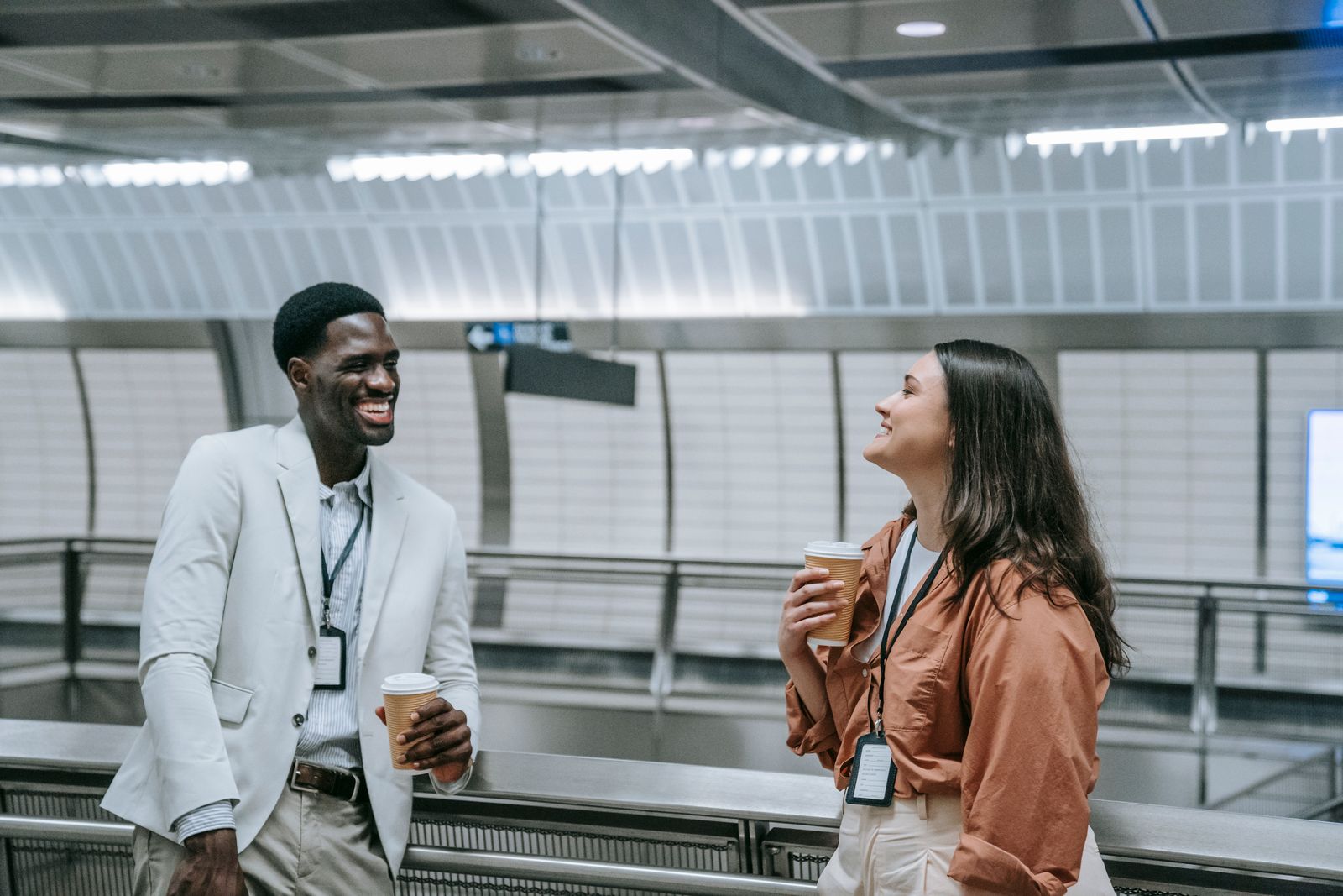Two business professionals talking over coffee